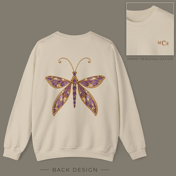 Back of sand sweatshirt with jeweled amethyst lacewing brooch design; inset shows the front with personalized monogram on the left chest