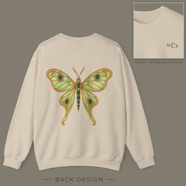 Back of sand sweatshirt with jeweled emerald luna moth brooch design; inset shows the front with personalized monogram on the left chest