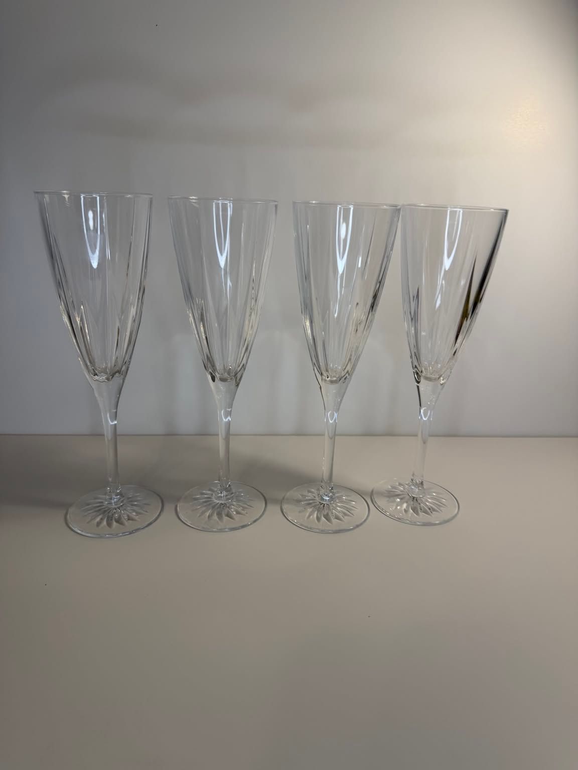 Set of four vintage cut glass champagne flutes