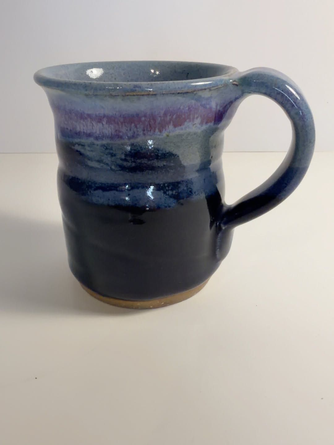 Signed handmade studio pottery mug in blue and purple glaze