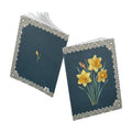 March birth flower journal with yellow daffodil oil painting art and lace border on a teal cover