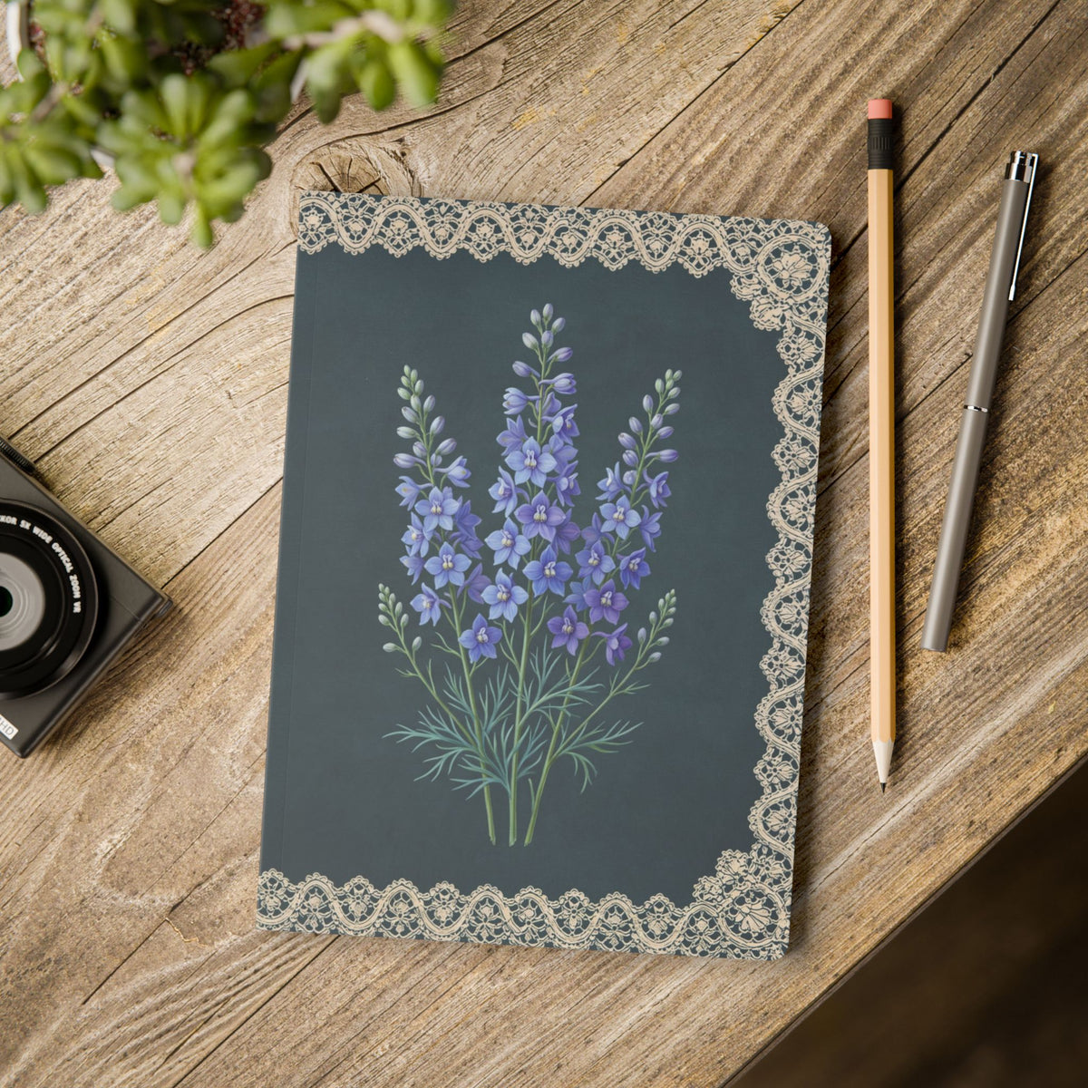 July birth flower journal with blue larkspur oil painting art and lace border on a teal cover, view 11