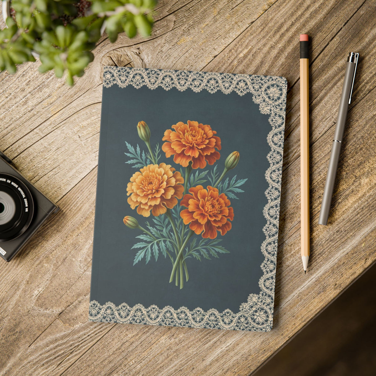 October birth flower journal with orange marigold oil painting art and lace border on a teal cover, view 11