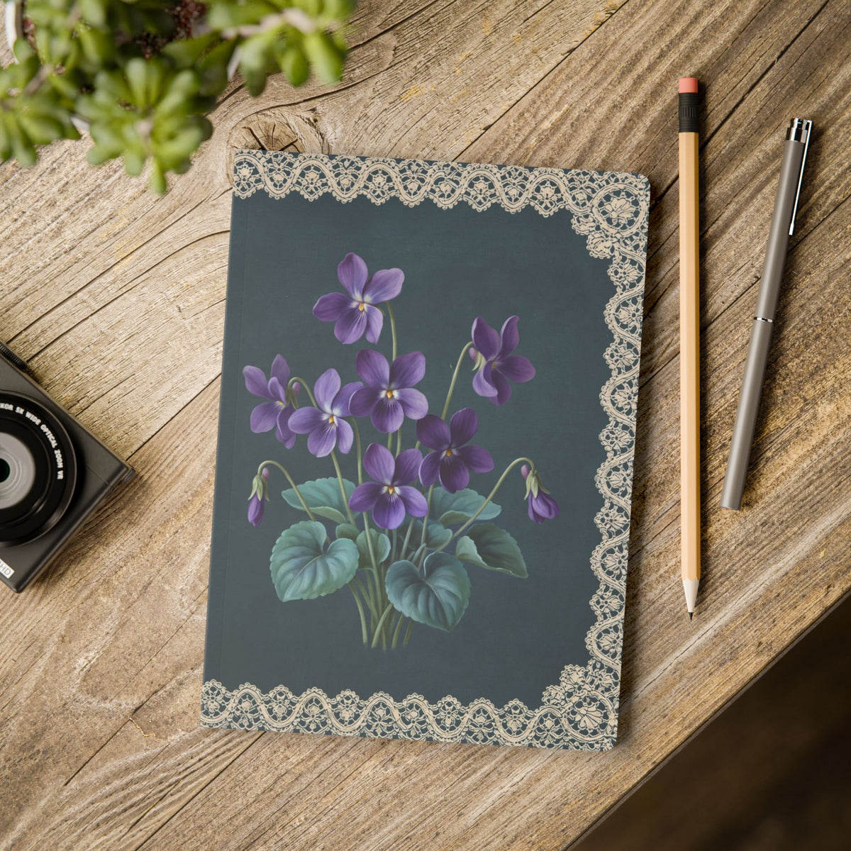 February birth flower journal with purple violet oil painting art and lace border on a teal cover, view 11