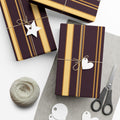 1960s-inspired gold stripe wrapping paper on deep plum