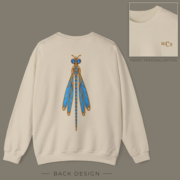 Back of sand sweatshirt with jeweled blue topaz dragonfly brooch design; inset shows the front with personalized monogram on the left chest