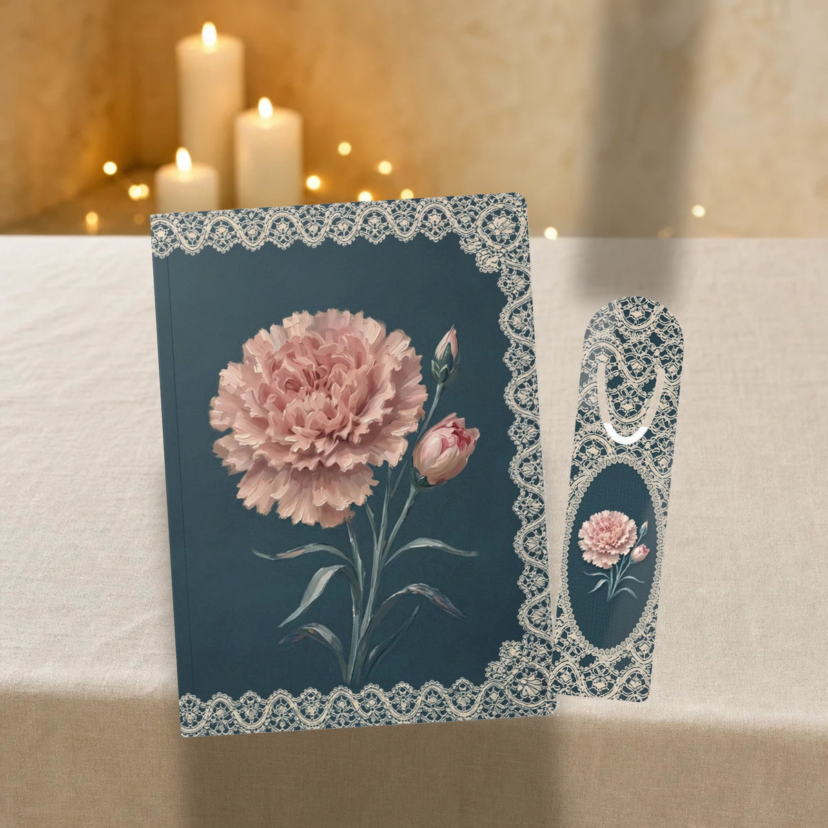 Pink carnation birth flower journal with matching lace carnation metal bookmark on a linen table