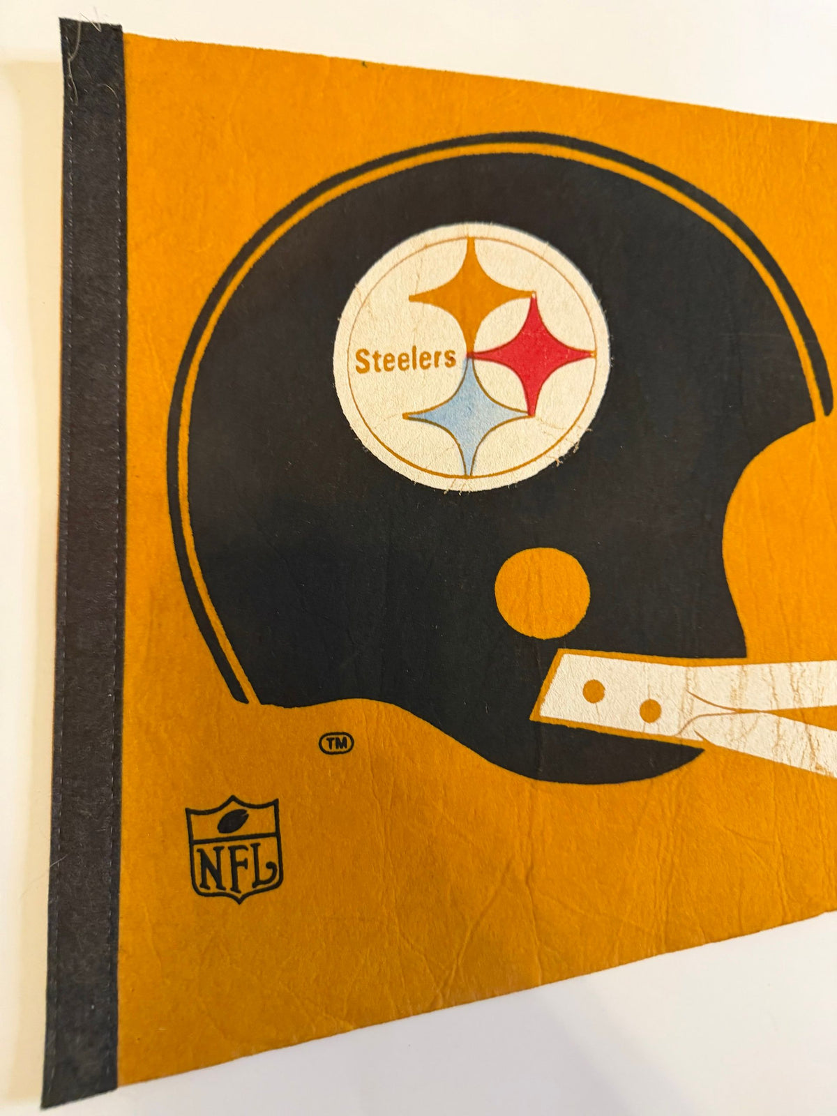Two-bar helmet and NFL shield close-up