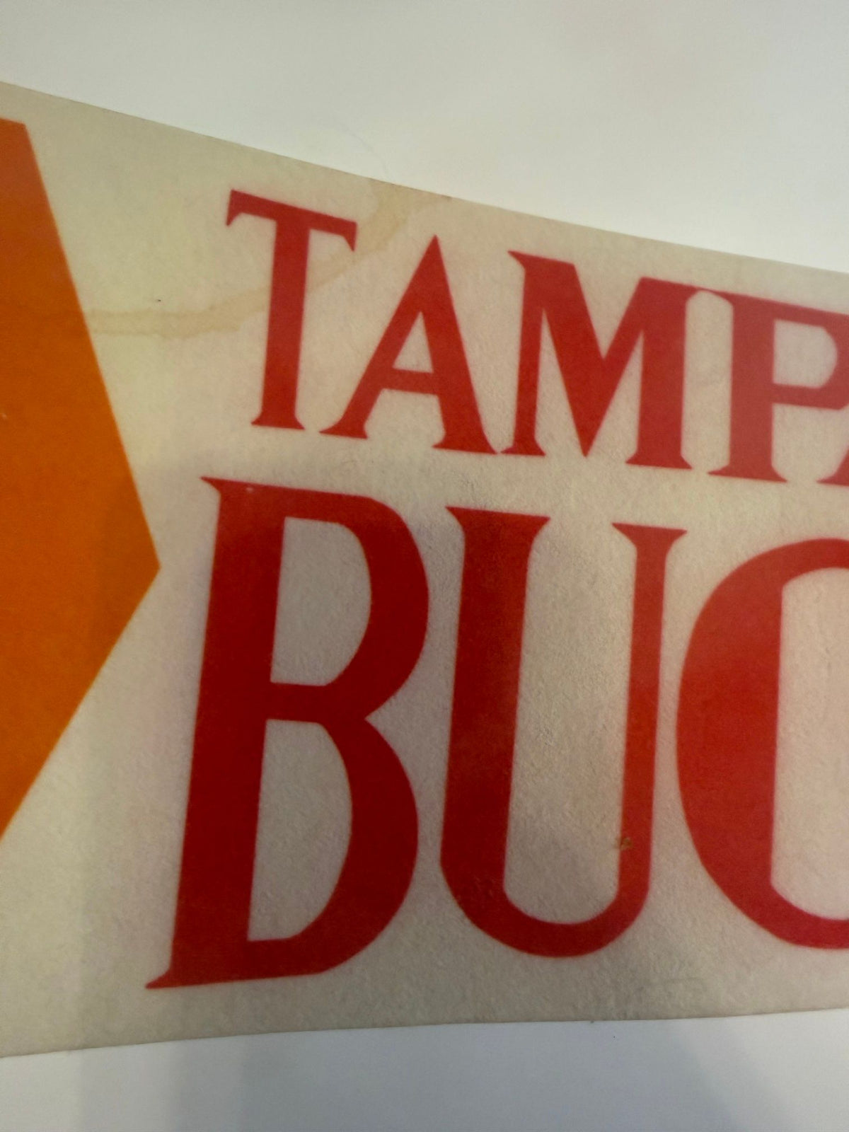 Lettering with tan water stain
