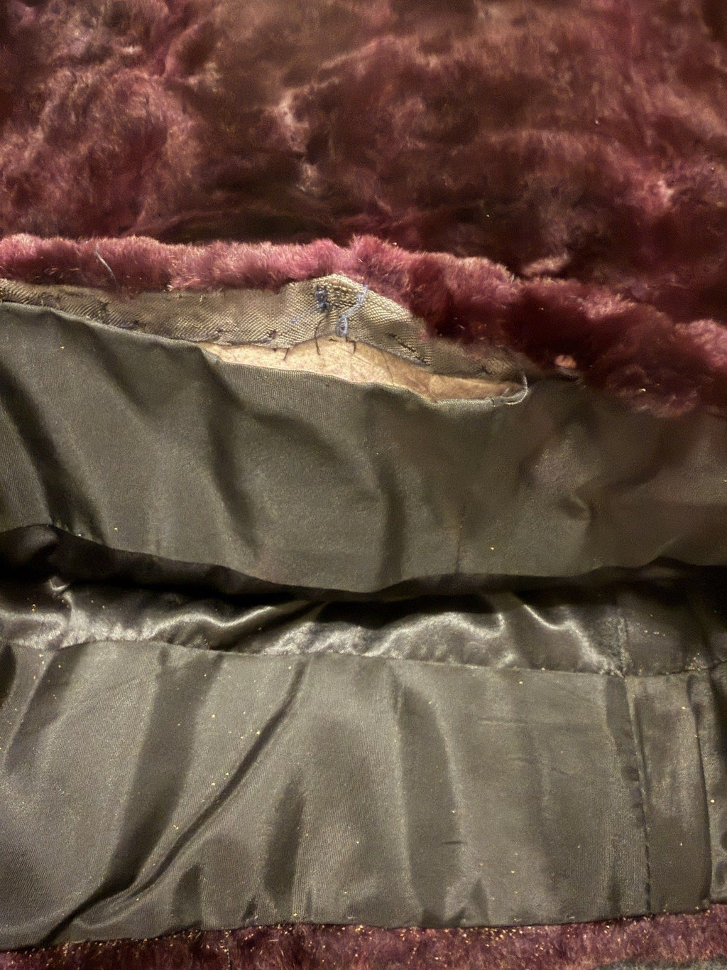 Loose lining at hem showing backing