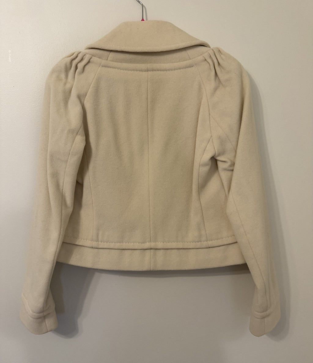 Back of cream cropped peacoat with gathered shoulders