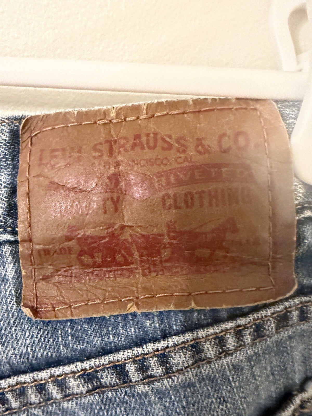 Worn two-horse leather back patch