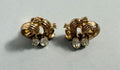 Vintage signed Tilari gold tone swirl rhinestone clip-on earrings