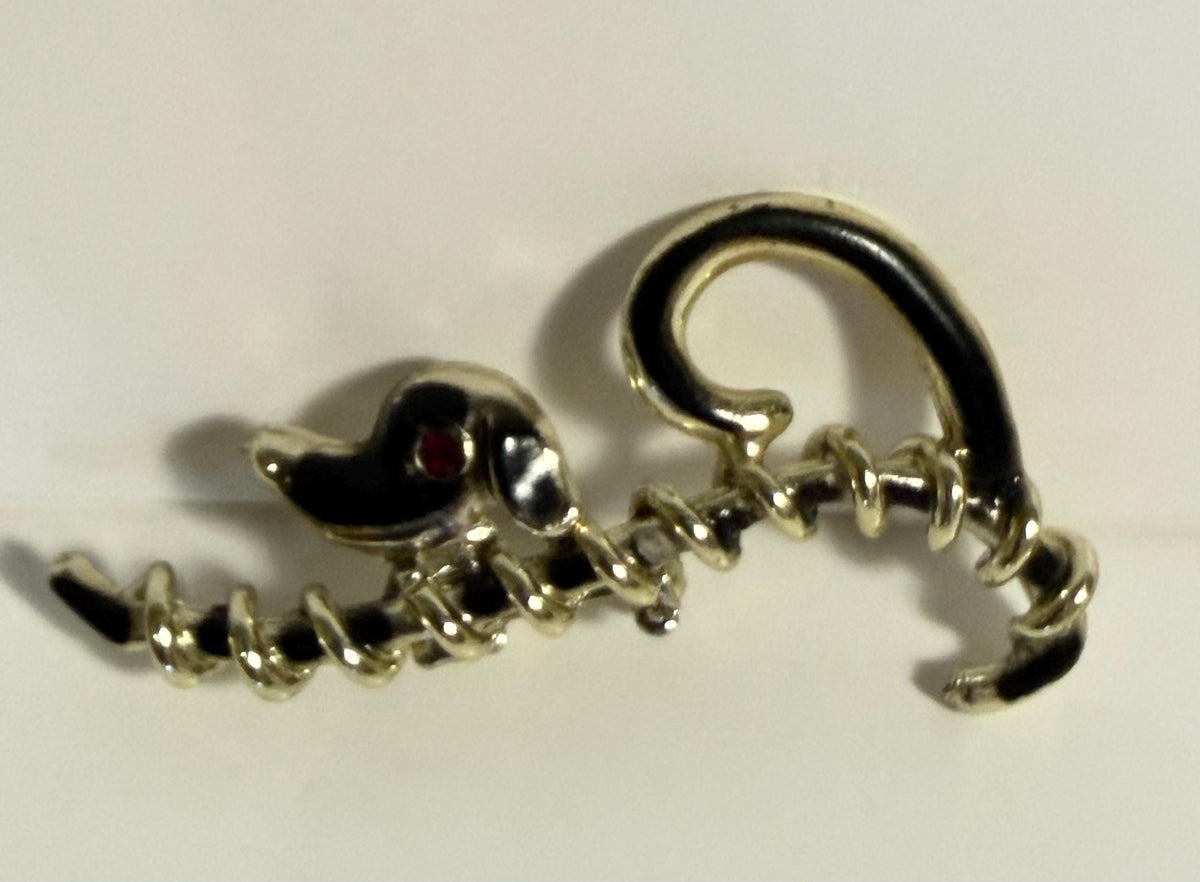 Vintage silver-tone dachshund brooch with red rhinestone eye