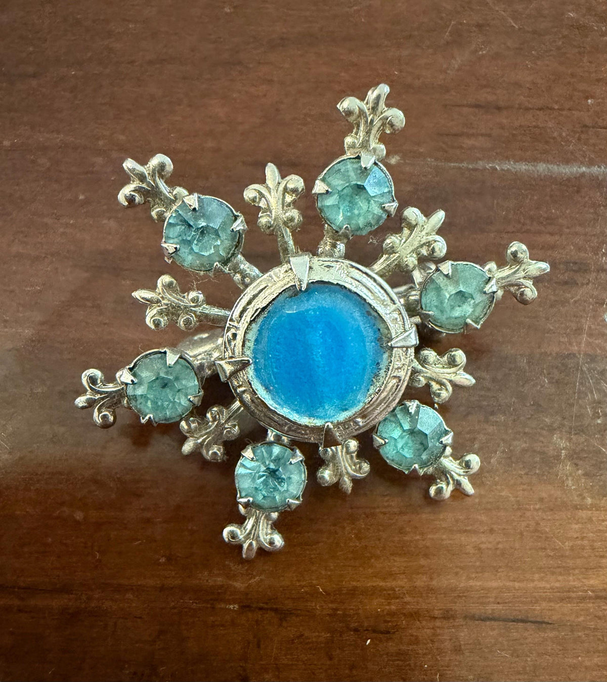 Vintage blue cabochon rhinestone fleur de lis brooch