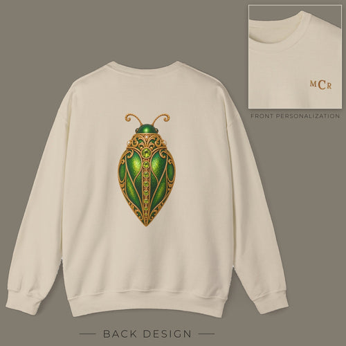 Back of sand sweatshirt with jeweled peridot beetle brooch design; inset shows the front with personalized monogram on the left chest
